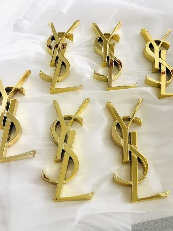 electroplated gold mirror finish logos for YSL store design